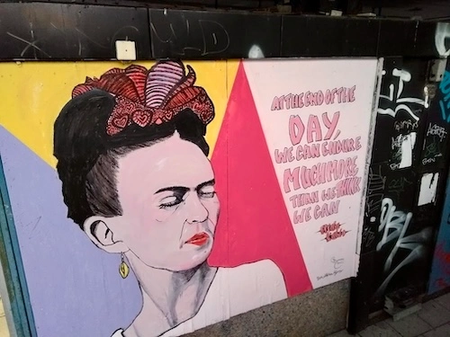 Frida Kahlo mural in Göteborg with text about endurance and making more than we think we can.
